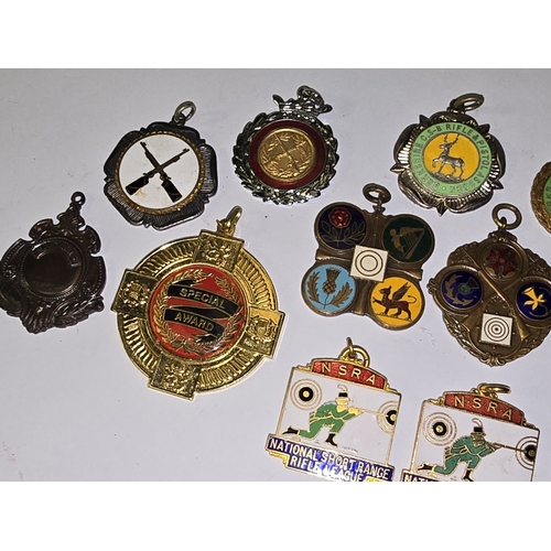 157 - A collection of vintage mostly rifle related medals/fobs to include National Small Bore Rifle Associ... 