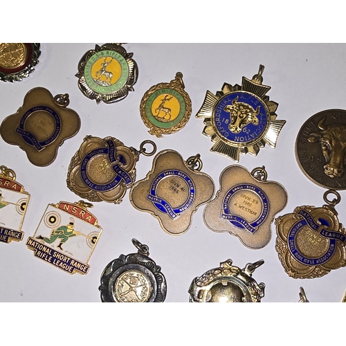 157 - A collection of vintage mostly rifle related medals/fobs to include National Small Bore Rifle Associ... 