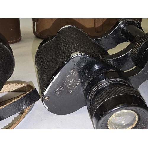 169 - Three pairs of vintage binoculars all with original cases.