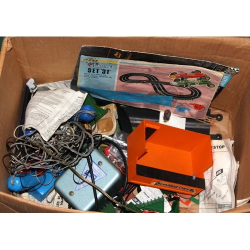 333 - A large quantity of vintage Scalextric track, trackside buildings and accessories, people etc. Inclu... 