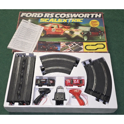 316 - Scalextric Ford RS Cosworth slot car racing set. Appears complete in original box but not checked fu... 