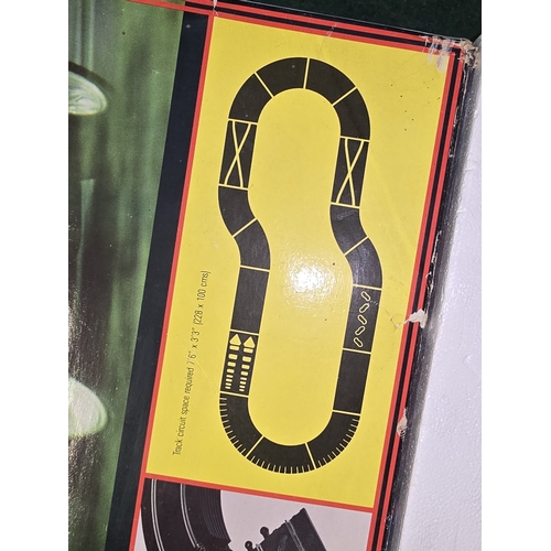 316 - Scalextric Ford RS Cosworth slot car racing set. Appears complete in original box but not checked fu... 