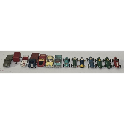 329 - A collection of vintage play worn die cast to include Dinky and Corgi sports cars.