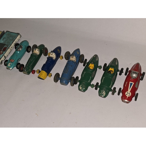 329 - A collection of vintage play worn die cast to include Dinky and Corgi sports cars.