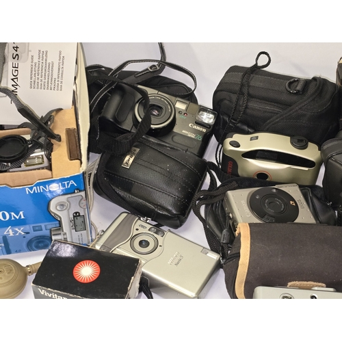 A collection of vintage cameras, video cameras and accessories. Good ...