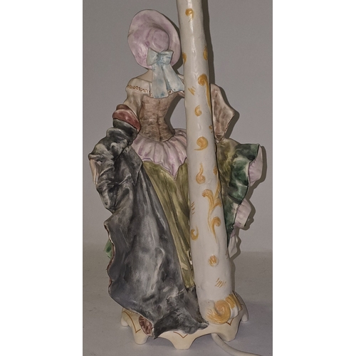 32 - A mid 20th century porcelain table lamp in the Dresden/Capodimonte style depicting a Victorian lady ... 