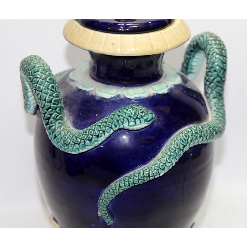 37 - Antique Wilhelm Schiller & Son Majolica lidded vase featuring a snake set in relief. Marked to base.... 