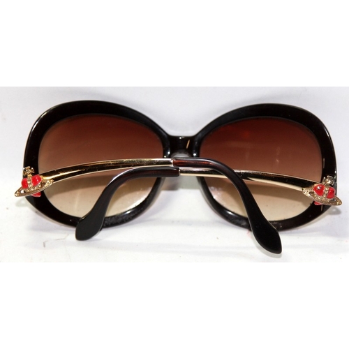 5A - A pair of Vivienne Westwood designer sunglasses c/w case (case has wear). From a single owner collec... 