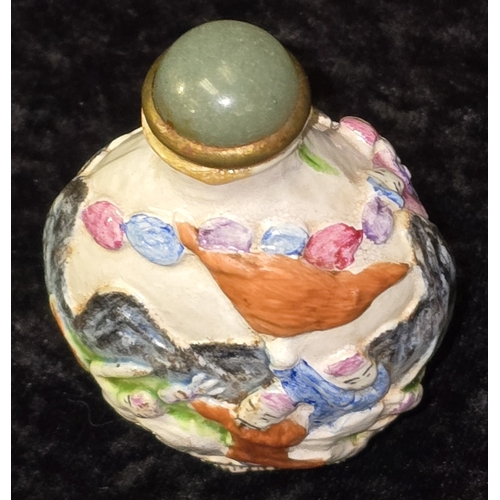 283 - Antique 19th Century Qing Dynasty Chinese Famille Rose moulded porcelain snuff box. 8cm tall. Slight... 