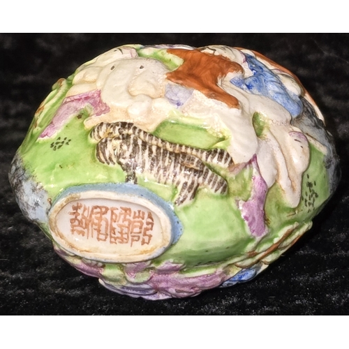 283 - Antique 19th Century Qing Dynasty Chinese Famille Rose moulded porcelain snuff box. 8cm tall. Slight... 