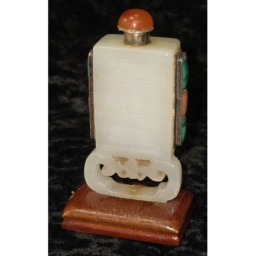 298 - Chinese pale celadon jade rectangular snuff bottle. On polished wooden base decorated with semi prec... 