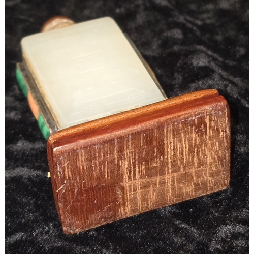 298 - Chinese pale celadon jade rectangular snuff bottle. On polished wooden base decorated with semi prec... 