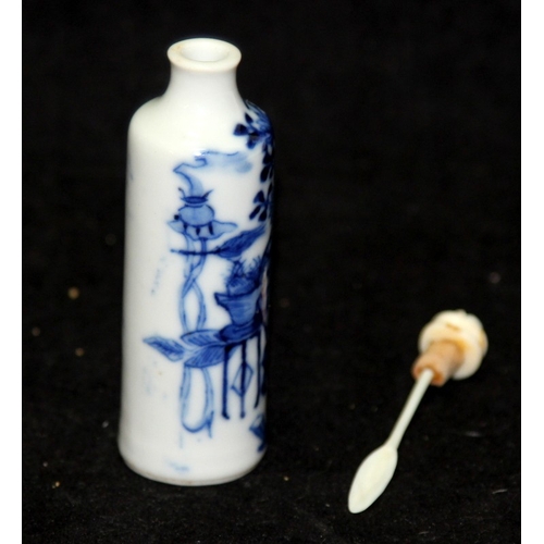 297 - Antique Oriental Snuff Bottle: Of cylindrical form with blue and white floral decoration. O/all 10cm... 