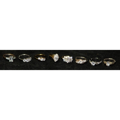 246 - A collection of 8 jewelled dress rings, 5 of them silver.