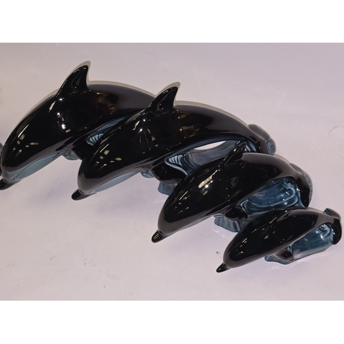 22 - Poole Pottery collection of blue glazed dolphins to include a double dolphin (5).