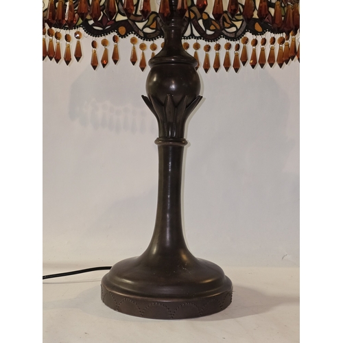 35 - A contemporary tiffany style table lamp with shade. 71cm tall.