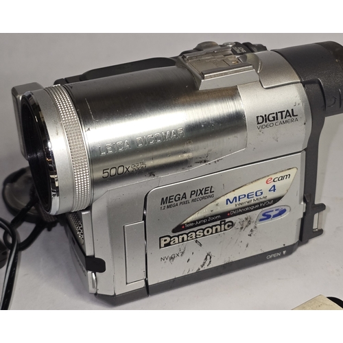55 - Panasonic NV-GX7 Handheld MiniDV Cassette Camcorder together with charger and two batteries. Powers ... 