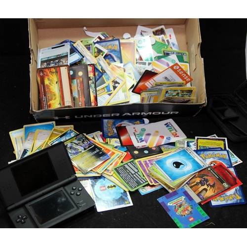 Nintendo DS Lite (no power cable, untested) c/w a quantity of trading cards  including pokemon