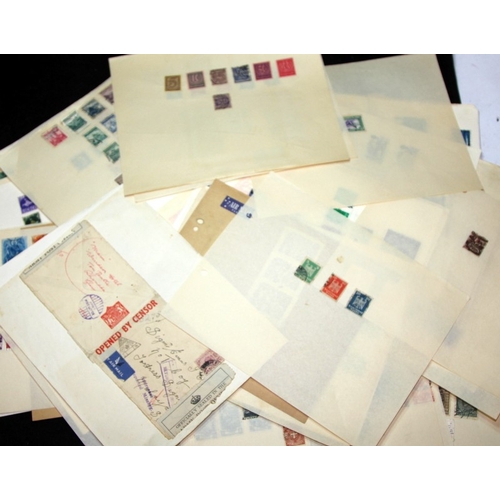 A good selection of world stamps presented on loose leaves, includes ...