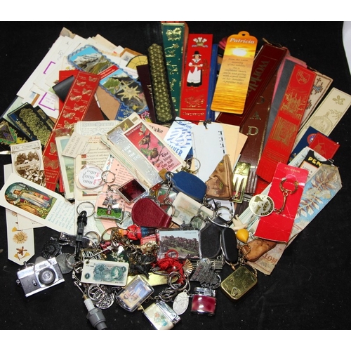A large collection of vintage keyrings and bookmarks