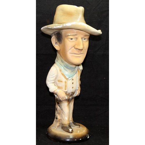 17 - 1970's ESCO chalkware caricature of John Wayne, 44cms tall c/w a 1954 John Wayne Adventure Annual.