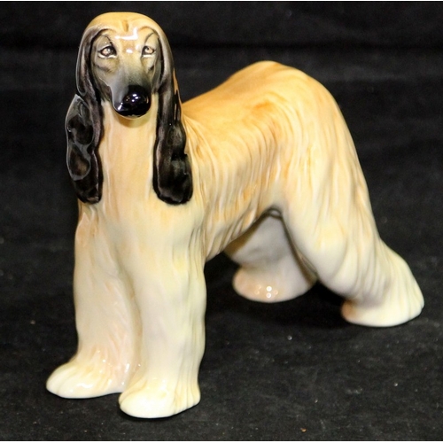 31 - Three large Beswick dog figurines. Alsatian, Afghan Hound and English Setter, the largest being 23cm... 
