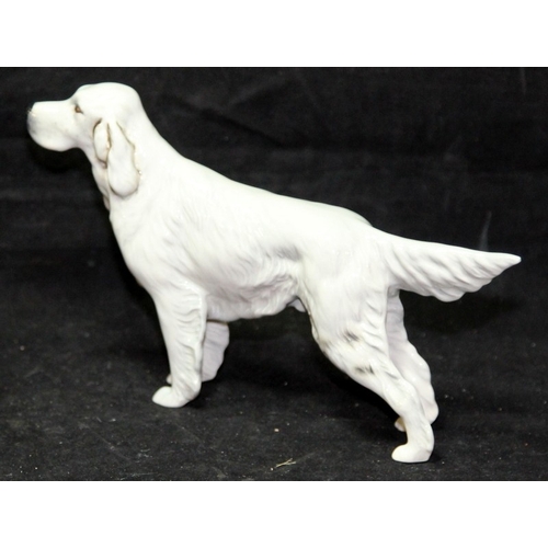31 - Three large Beswick dog figurines. Alsatian, Afghan Hound and English Setter, the largest being 23cm... 