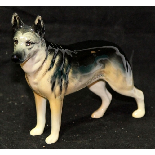 31 - Three large Beswick dog figurines. Alsatian, Afghan Hound and English Setter, the largest being 23cm... 