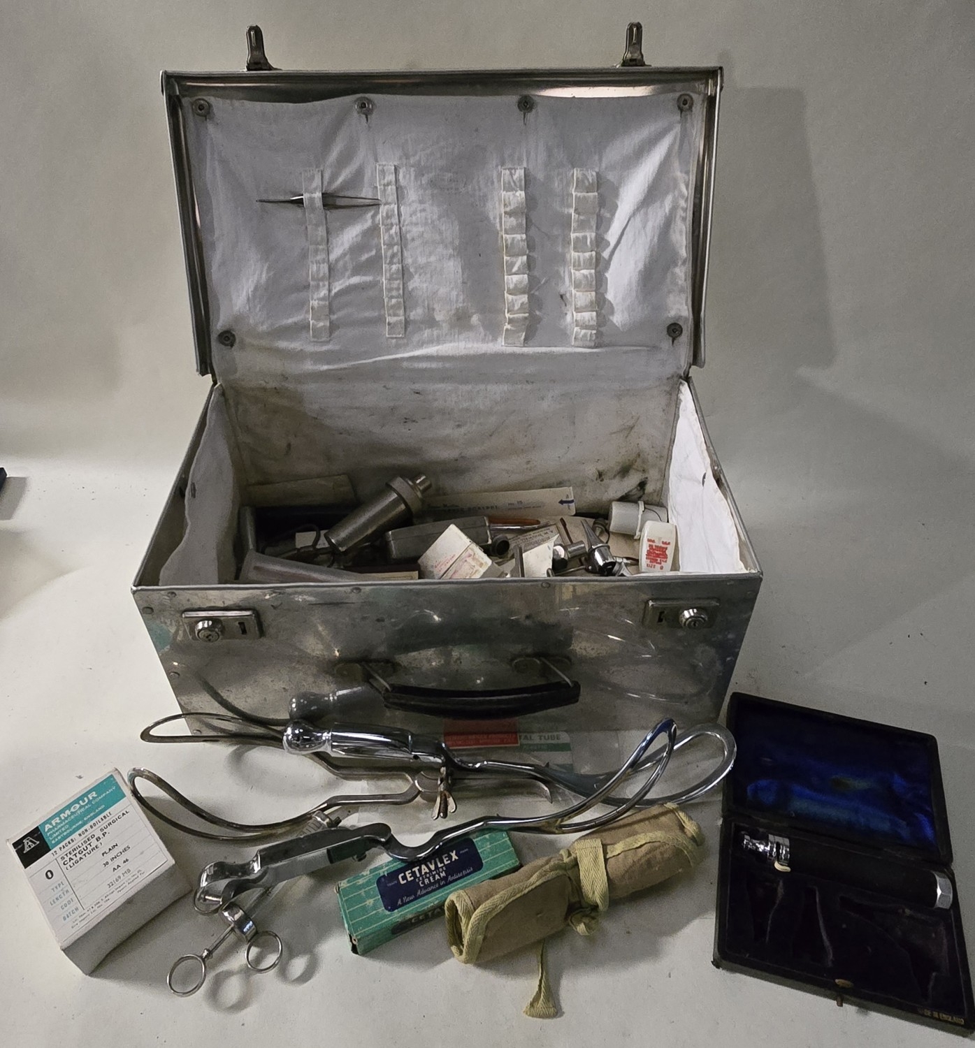 A vintage medical box with contents to include doctors/nurses tools.