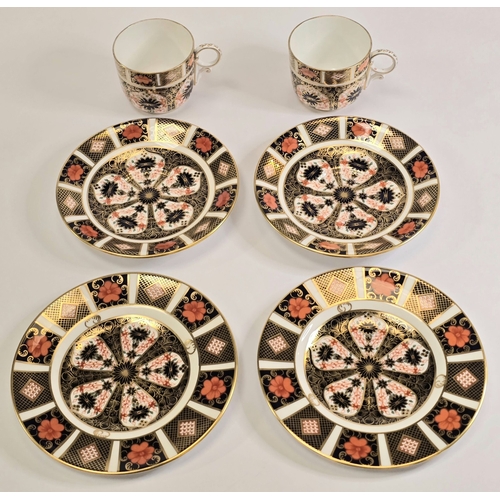221 - Royal Crown Derby: A pair of 1128 Old Imari pattern coffee can trios to include cup, saucer and side... 