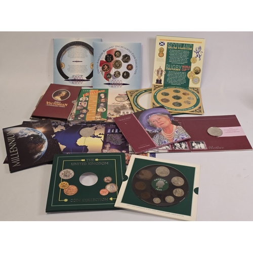 296 - Collection of crowns and year coin sets in presentation wallets.