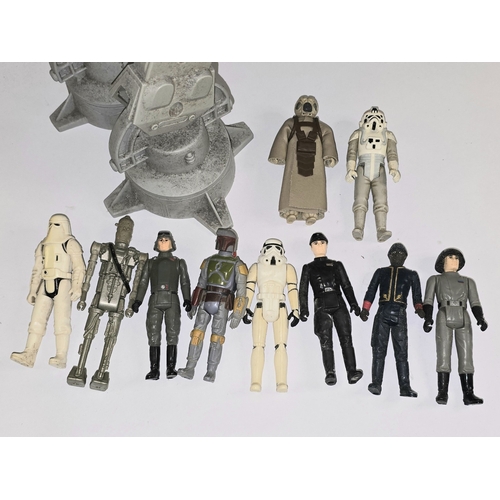 48 - A vintage Kenner Star Wars AT-AT Walker together with an assortment of Star Wars action figures.