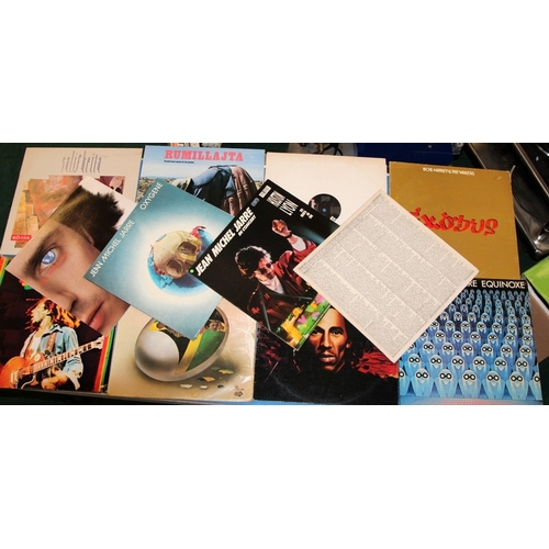 240 - A collecgtion of vinyl LP's featuring continental artists, Bob Marley, Jean Michel Jarre, Salif Keit... 