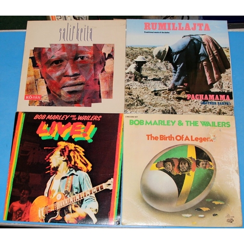 240 - A collecgtion of vinyl LP's featuring continental artists, Bob Marley, Jean Michel Jarre, Salif Keit... 