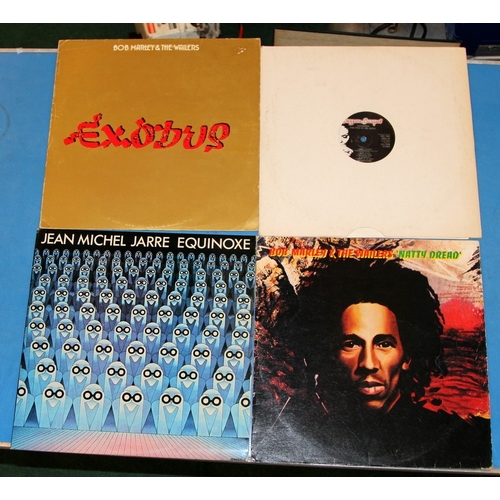 240 - A collecgtion of vinyl LP's featuring continental artists, Bob Marley, Jean Michel Jarre, Salif Keit... 