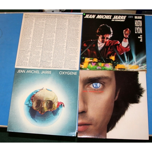 240 - A collecgtion of vinyl LP's featuring continental artists, Bob Marley, Jean Michel Jarre, Salif Keit... 