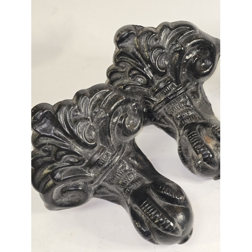 62 - A set of four vintage cast metal ball and claw feet originally belonging to a bathtub. Each 19cm tal... 