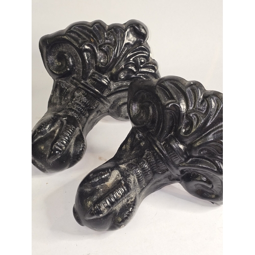 62 - A set of four vintage cast metal ball and claw feet originally belonging to a bathtub. Each 19cm tal... 