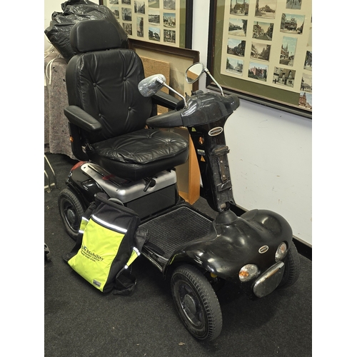 51 - A Shoprider deluxe mobility scooter. Seen recently in working order. Comes with charger and key