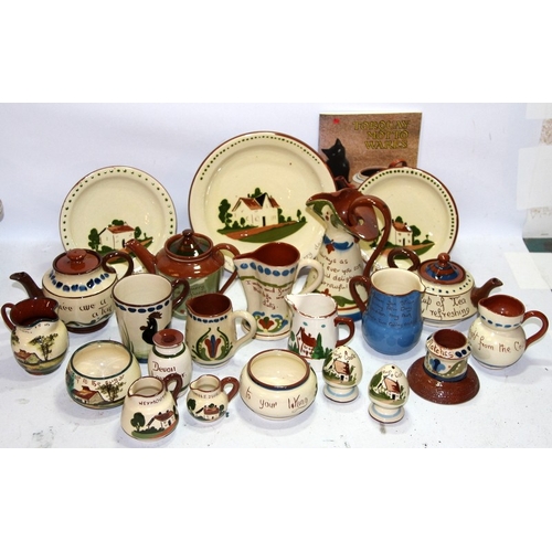 30 - A collection of Torquay Motto Ware, Includes teapots, jugs etc. Lot also includes a guide to collect... 