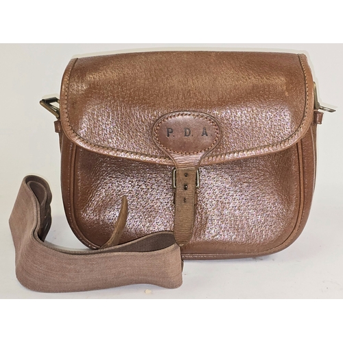 22 - A vintage Brady brown pigskin leather cartridge bag. Includes strap. Good condition for age.