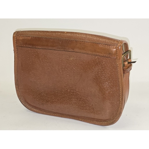 22 - A vintage Brady brown pigskin leather cartridge bag. Includes strap. Good condition for age.