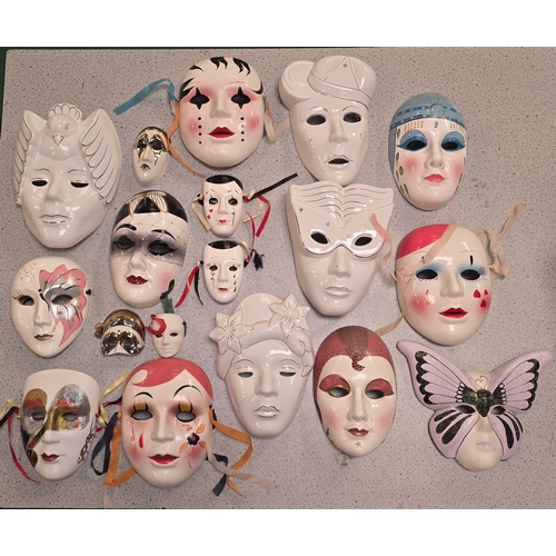 45 - A collection of porcelain and pottery masks to include Masquerade and Mime themes.