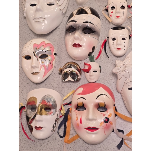 45 - A collection of porcelain and pottery masks to include Masquerade and Mime themes.