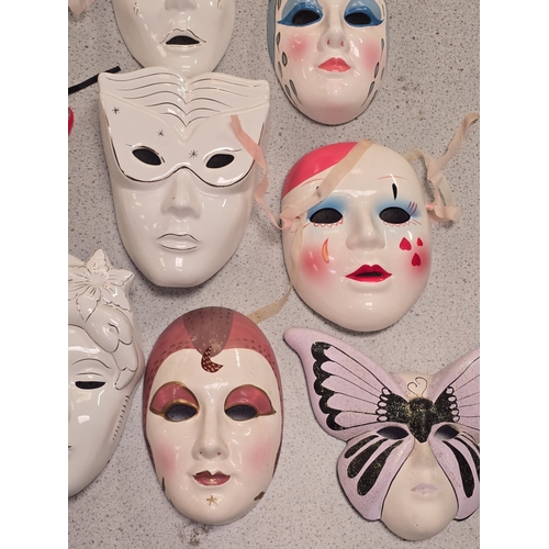 45 - A collection of porcelain and pottery masks to include Masquerade and Mime themes.