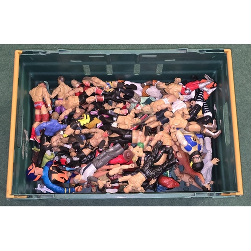 32 - A large tub of various plastic action figures to include wrestling and Action Man examples.