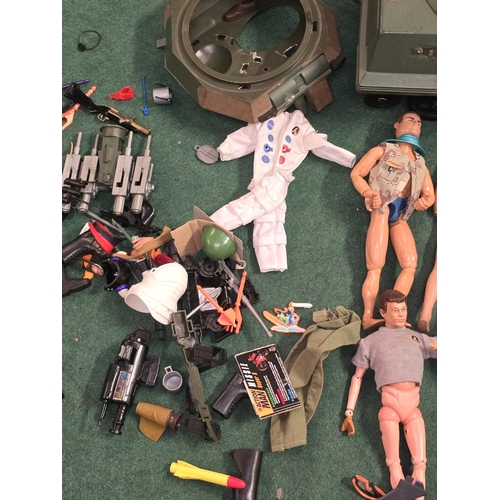33 - A large collection of Action Man figures, vehicles, clothing and accessories. Includes a couple of e... 