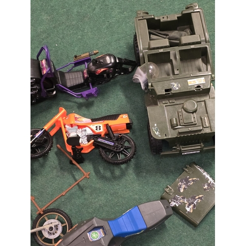 33 - A large collection of Action Man figures, vehicles, clothing and accessories. Includes a couple of e... 