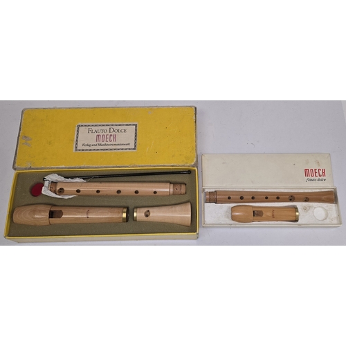 31 - A vintage Flauto Dolce Moeck German wooden recorder together with another smaller recorder. Both app... 