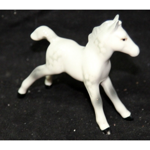 10 - A pair of large Beswick shire horses, 22cms tall c/w a small Beswick dapple grey foal and two Beswic... 